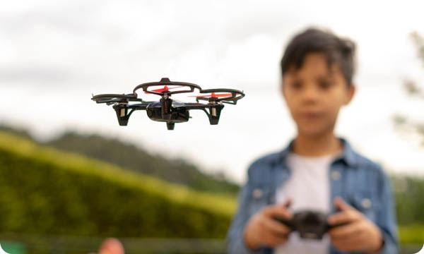 Close up of Child Flying Drone in the Park
