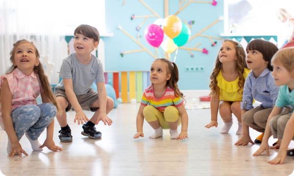 Children playing together in a movement class