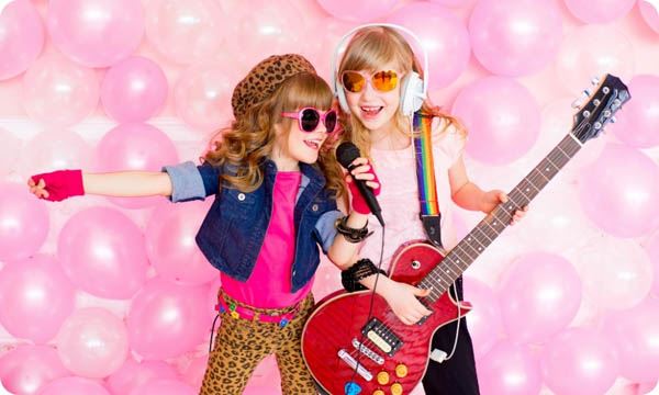 Two Little Girl with a Microphone