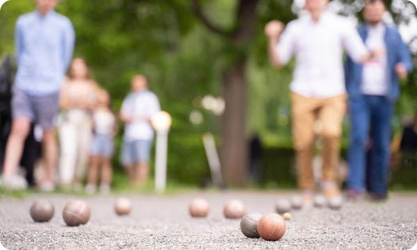 People playing bocce ball outside