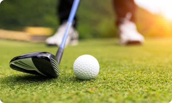 Golf Ball on Green Grass Ready to Be Struck at Golf Club