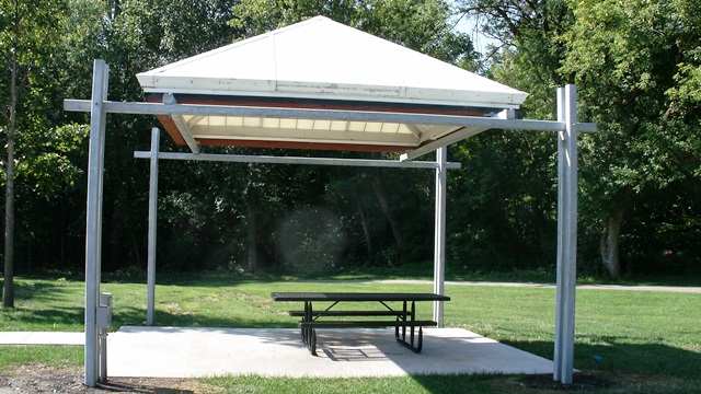 A picnic shelter and picnic table in a city park